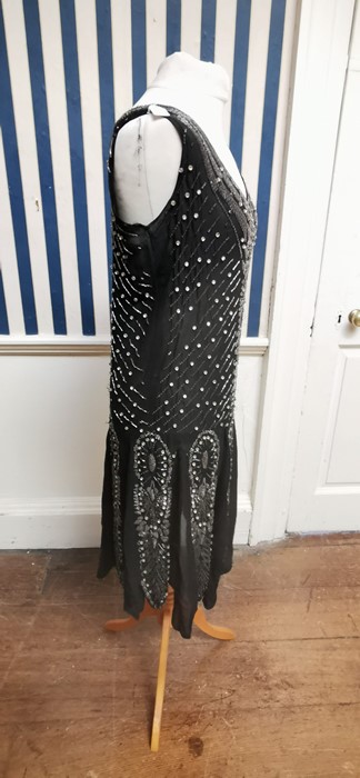 A black beaded Art Deco 1920s dress, this iconic dress is embellished in silver and black bugle - Image 2 of 14