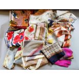 A collection of 17 scarves to include hunting scenes, golf scenes, etc. Scarves are square shape,