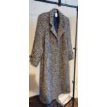 A herringbone tweed wool coat 1980s in beige and navy with a navy lining size 12 and a cream lambs