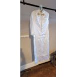 A white grosgrain wedding dress, mid to late 1960's, the style is of a sheaf design with wide