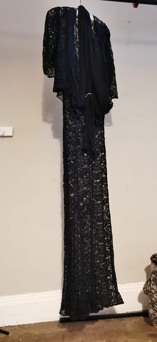 WITHDRAWN A black 1930s lace evening frock which has a crepe bodice with inserts of black lace.