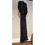 WITHDRAWN A black 1930s lace evening frock which has a crepe bodice with inserts of black lace.