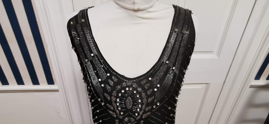 A black beaded Art Deco 1920s dress, this iconic dress is embellished in silver and black bugle - Image 8 of 14