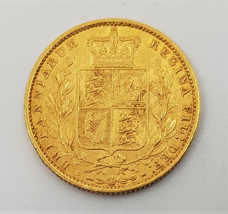 An 1861 Victoria "Young bust" gold sovereign, rev. shield. - Image 2 of 2