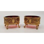 A pair of Victorian silver gilt pierced oval salts, by Alexander Macrae, London 1874, in the neo-