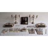 A collection of silver plated table and flatware, to include: a pair of three branch candelabra,