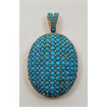 An early 20th century French 18ct. gold, turquoise and seed pearl set oval pendant locket, the domed