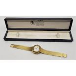 A 14ct. gold Exquisit automatic ladies' bracelet watch, having signed silvered dial, 26.5mm wide