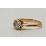 A precious yellow metal solitaire diamond ring, claw set cushion cut old cut diamond (approx. weight