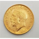 A 1911 George V gold sovereign, London mint.