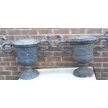 A pair of 19th cent lead urn  planters height 54cm condition good