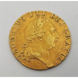 A 1788 George III gold spade guinea, obv. fifth laureate head, rev. spade shaped shield. Grade as