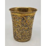 An Islamic white and yellow metal beaker, impressed mark to base, height 10cm..