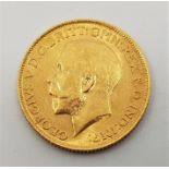 A 1912 George V gold sovereign, London mint.