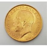 A 1925 George V gold sovereign, Pretoria mint.