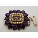 A 19th century precious yellow metal, amethyst and pearl set mourning brooch, having braided hair