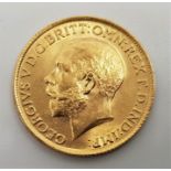 A 1915 George V gold sovereign, London mint.