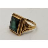 An antique precious yellow metal and tourmaline dress ring, having single rectangular cut tourmaline