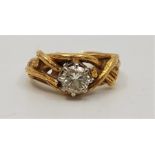 An 18ct. gold diamond solitaire ring, claw set round brilliant cut diamond (diamond weight approx.