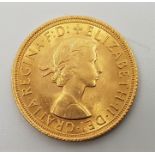A 1963 Elizabeth II gold sovereign.