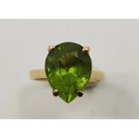 A 14ct, gold and peridot dress ring, set single mixed pendeloque cut peridot. (gross weight 4.8g)