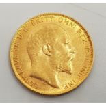 A 1909 Edward VII gold sovereign, London mint.