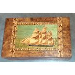 A large folk art interest writing slope with  marquetry sailing ship and original fitted
