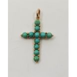 A 9ct. gold and turquoise cross, set circular cabochon turquoise to front, height exc. bail 24mm. (