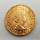 A 1959 Elizabeth II gold sovereign.