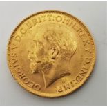 A 1912 George V gold sovereign, London mint.