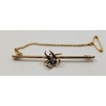 A 9ct. gold, cultured pearl and blue stone set "spider" bar brooch, length 52mm (gross weight 2.9g)