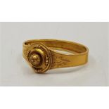 A 19th century precious yellow metal hinged mourning bangle, the front having fine wire work