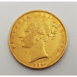 An 1861 Victoria "Young bust" gold sovereign, rev. shield.