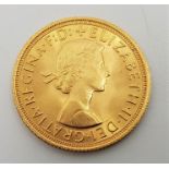 A 1963 Elizabeth II gold sovereign.