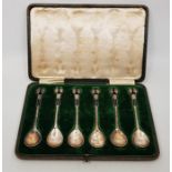 A set of six Art Nouveau silver spoons, by Albert Edward Jones, Birmingham 1911, having hammered