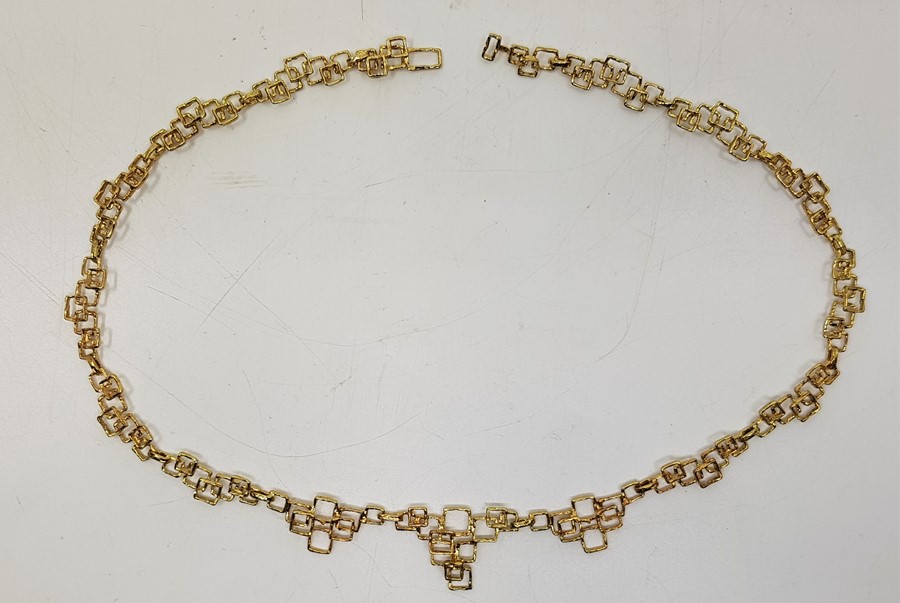 A 1970's 9ct. gold necklace, formed from a series of links fashioned as overlapping graduated open