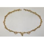 A 1970's 9ct. gold necklace, formed from a series of links fashioned as overlapping graduated open