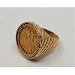 A 9ct. gold and half sovereign set ring, mounted with 1911 George V gold half sovereign. (gross