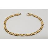 A 14ct. gold fancy link bracelet, with lobster claw clasp, length 19.5cm. (11.4g)