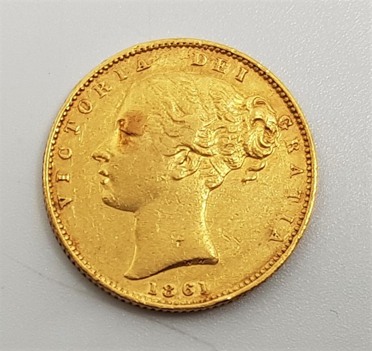 An 1861 Victoria "Young bust" gold sovereign, rev. shield.