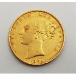 An 1861 Victoria "Young bust" gold sovereign, rev. shield.