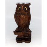 A late 19th century Black forest owl inkwell, with original glass eyes.