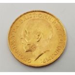 A 1925 George V gold sovereign, Pretoria mint.