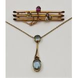 An early 20th century 15ct. gold and aquamarine choker pendant necklace, having bezel set round