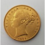An 1863 Victoria "Young bust" gold sovereign, rev. shield.