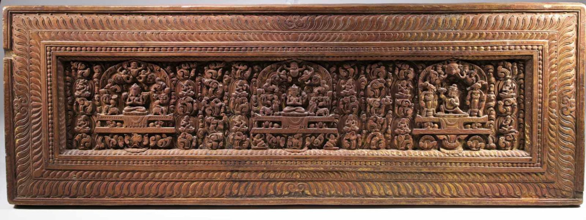 BOOK COVER WITH INSCRIPTIONSWood gilt and partly painted,Tibet, 17th centuryDimensions: Height 25 cm