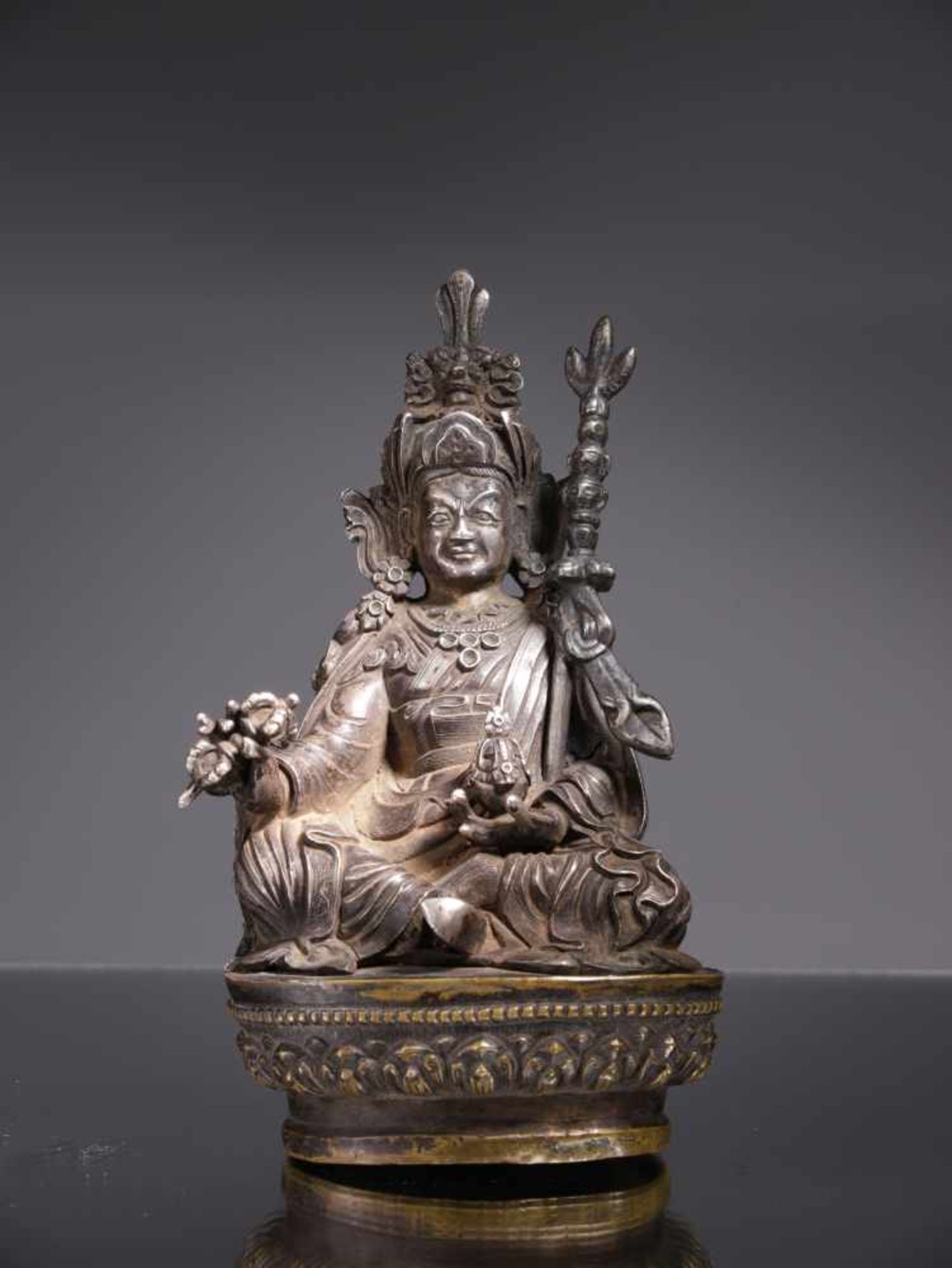 PADMASAMBHAVASilver sculpture on bronze base,Tibet or Bhutan , 18th centuryDimensions: Height 14