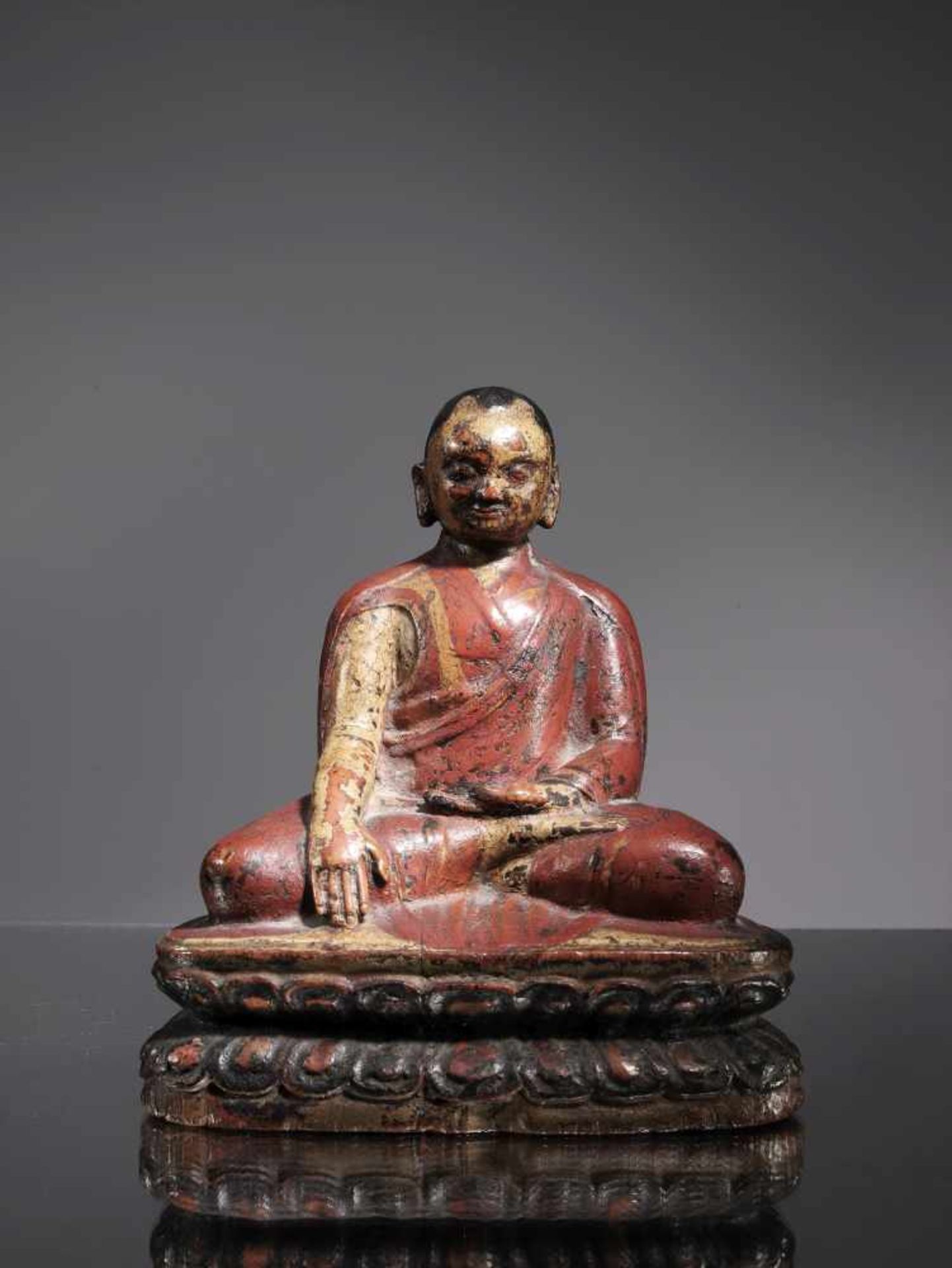 LAMAWood paintedTibet , 16th centuryDimensions: Height 15 cm Weight: 318 gramsLama seated on