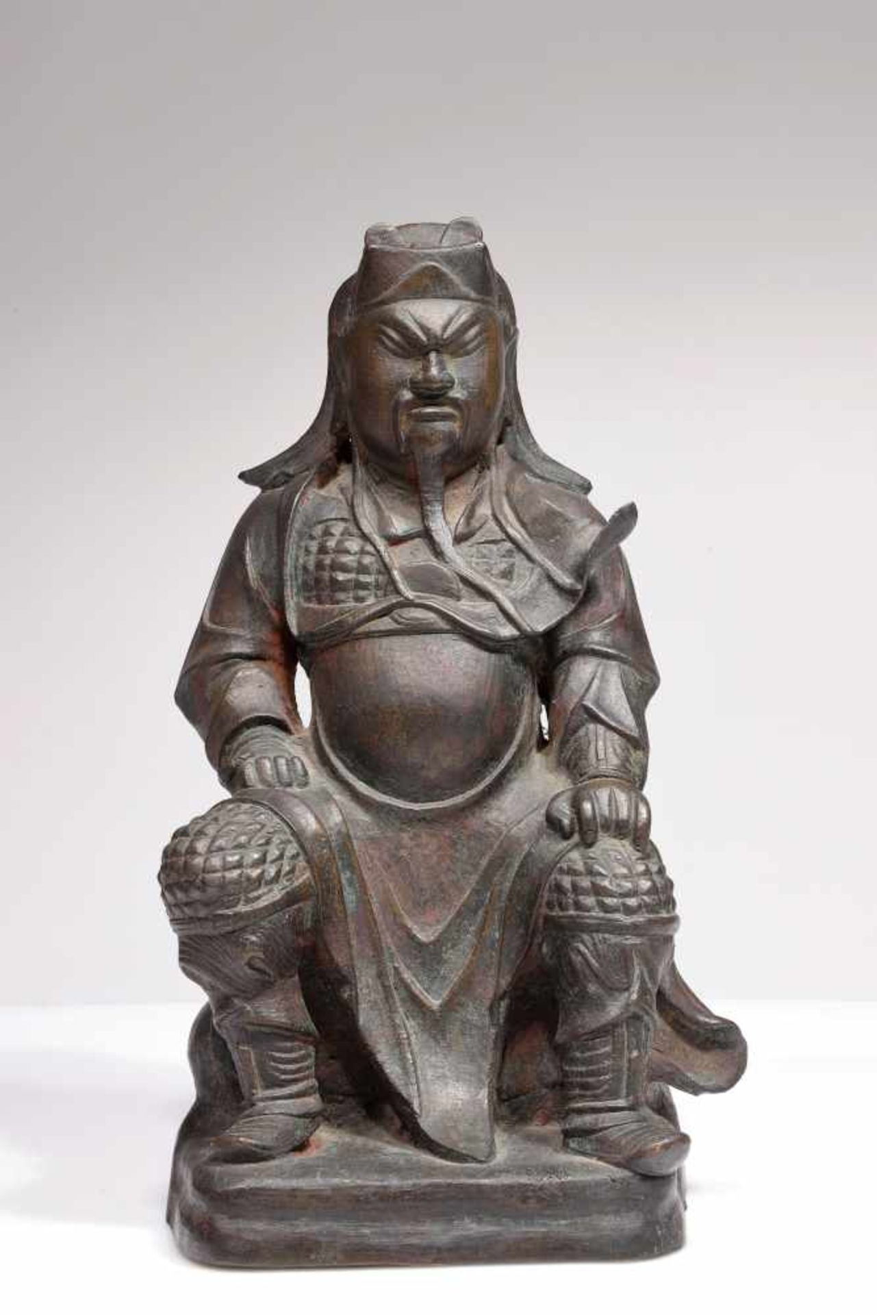 A RARE BRONZE CHINESE SITTING FIGURE OF GUAN GONG