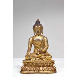 A BRONZE GILDED BUDDHA